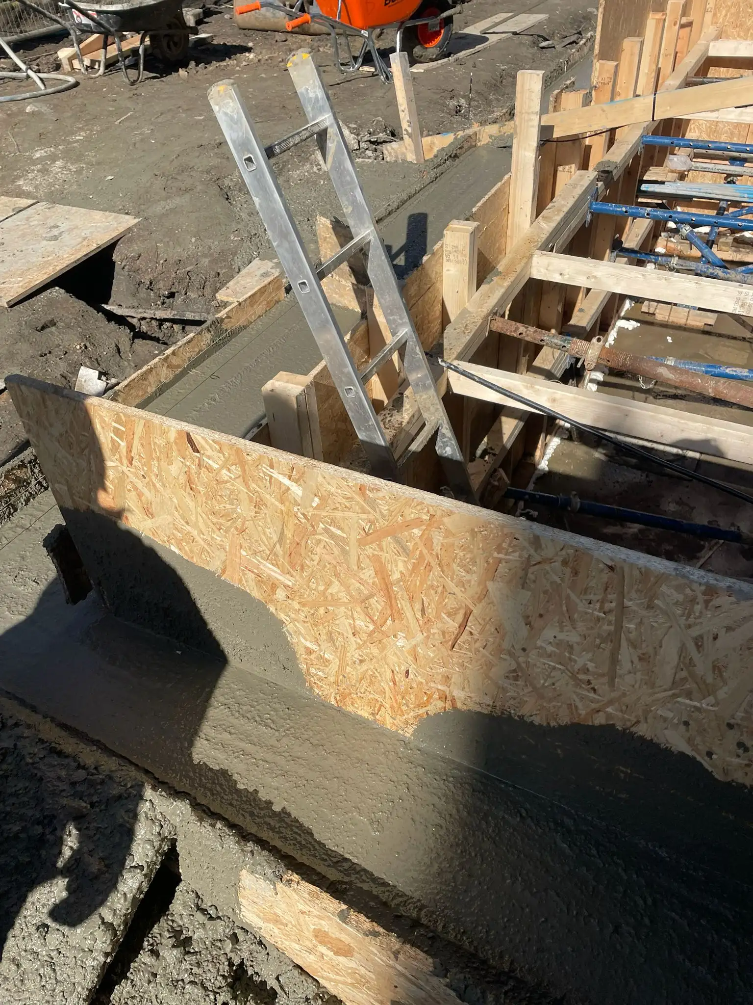 Basement construction logistics and neighbour management